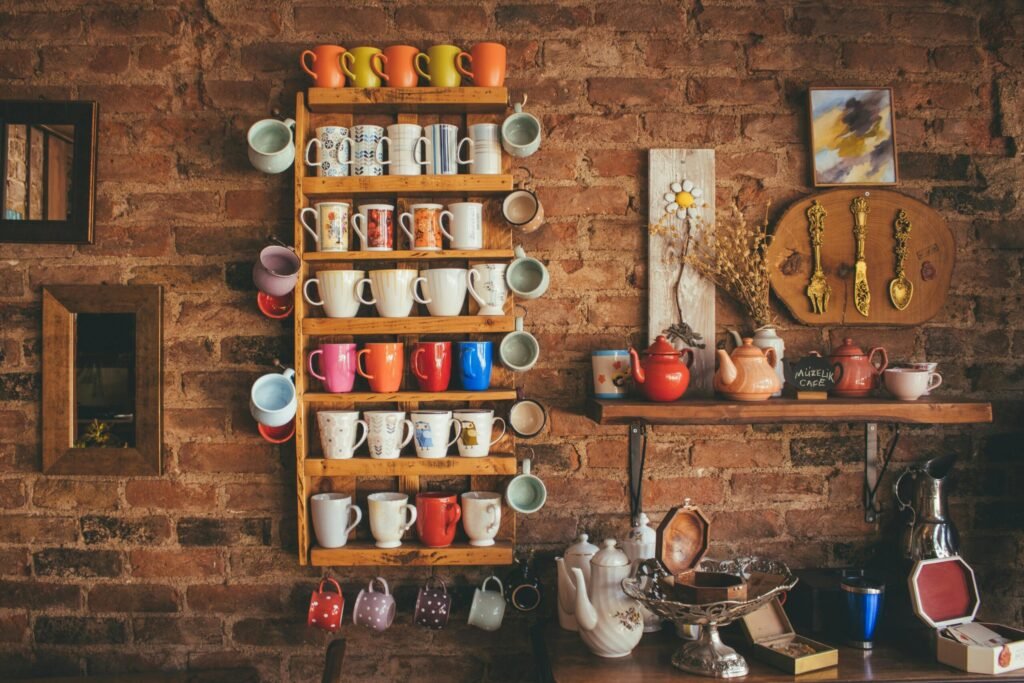 Assorted-color Mugs on Brown Wooden Floating Rack